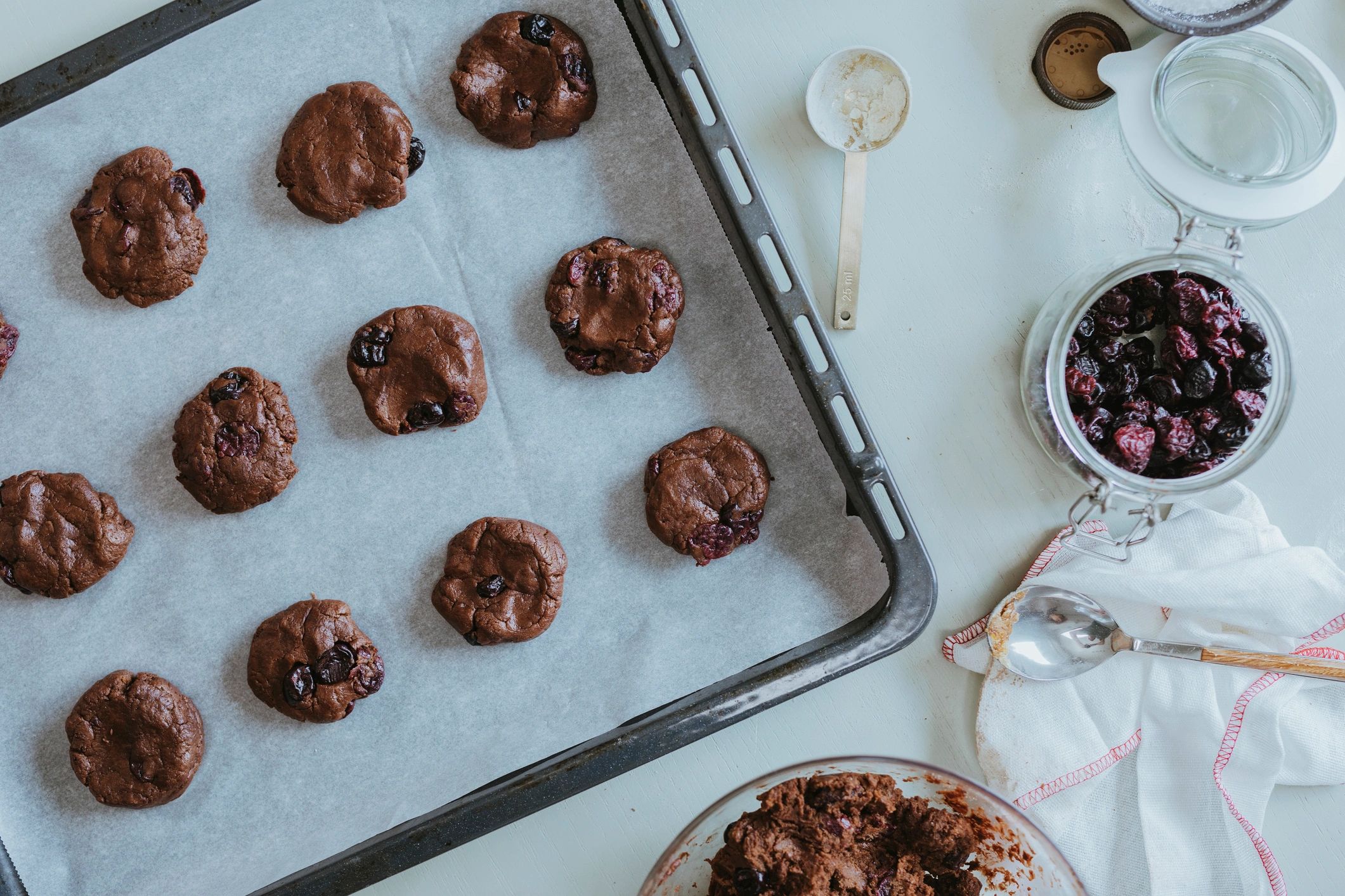 Chocolate chip cookies on a baking tray, overhead view