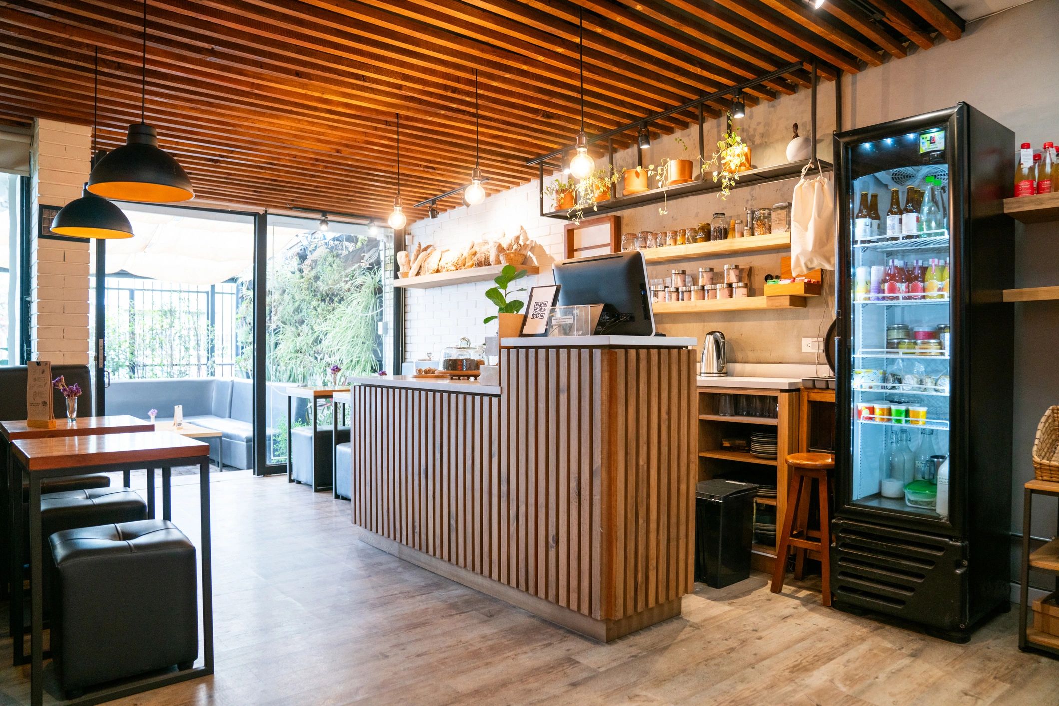 Cozy bakery-style cafe interior with warm lighting and counter seating