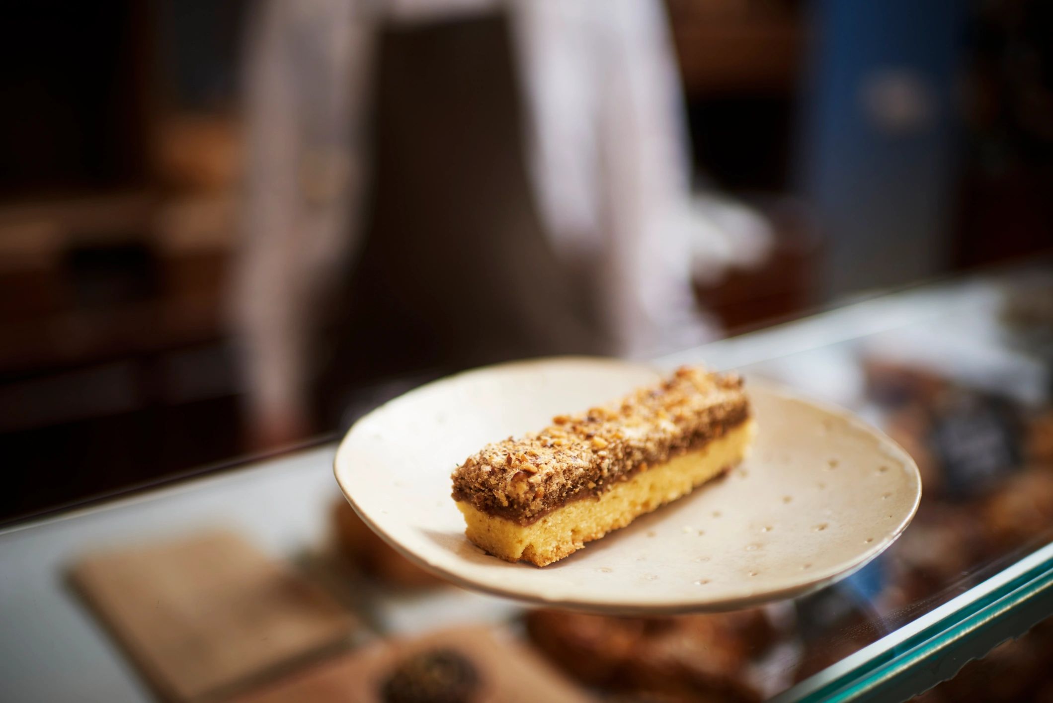 Cake slice in a bakery case, close-up